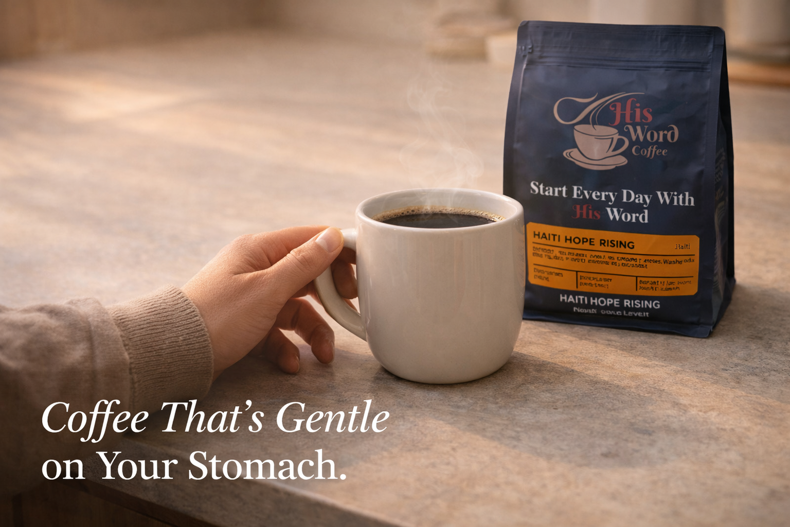 Hand reaching for a steaming mug of coffee beside a His Word Coffee Haiti Hope Rising bag on a stone countertop - His Word Coffee